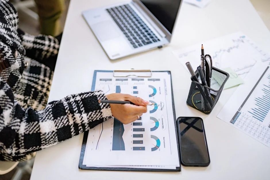 A desktop arrangement featuring social media marketing basics, including a keyboard, lightbox, and guide.